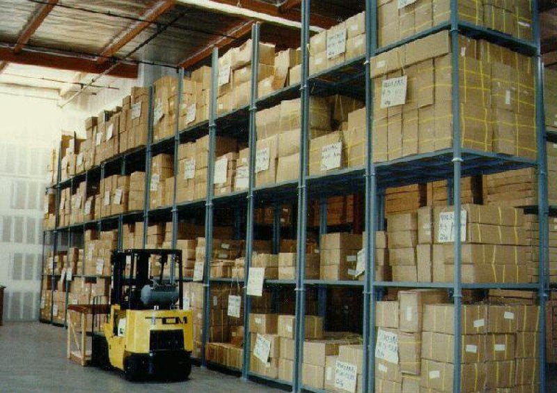 Stack racks in a warehouse with forklift